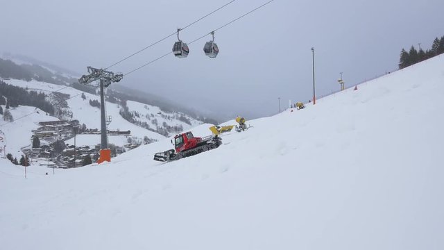 A ratrak and cable car at a ski resort