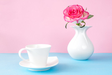 flower rose in a white vase on a pink blue graphic background in pastel colors layout in the Scandinavian style minimalism