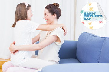 mothers day greeting against mother and daughter smiling at each other