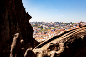 Old Lisbon Portugal panorama. cityscape with roofs. Tagus river. miraduro viewpoint. View from sao jorge castle. cannon