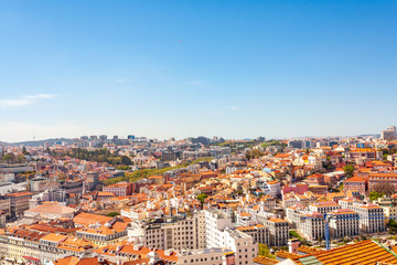 Fototapeta na wymiar Old Lisbon Portugal panorama. cityscape with roofs. Tagus river. miraduro viewpoint. View from sao jorge castle