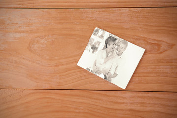 envelope red heart against old man tasting vegetable held by wife