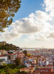 Old Lisbon oldtown panorama of Alfama. View to Saint George castle. Portugal cityscape with roofs. Tagus river. miraduro viewpoint
