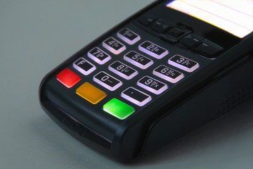 mobile acquiring terminal for payment of purchases. multicolored buttons