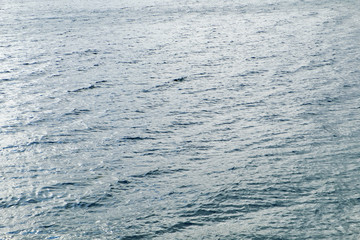 Blue surface of sea water, shot in the open calm sea directly from above