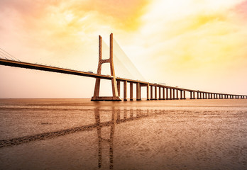 The Vasco da Gama Bridge in Lisbon, Portugal in a summer day. beautiful colors