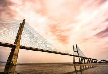 Obraz premium The Vasco da Gama Bridge in Lisbon, Portugal in a summer day. beautiful colors