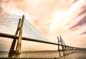 Fototapeta na wymiar The Vasco da Gama Bridge in Lisbon, Portugal in a summer day. beautiful colors