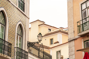 Old Lisbon Portugal steet. Arch and stair. Buildings facade