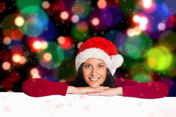 Woman smiling at the camera against blurred lights