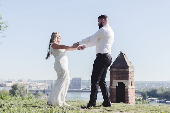 Just married couple dancing valse outdoor, free space.