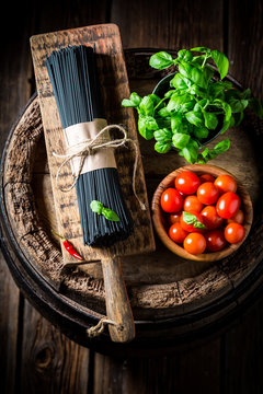 Ingredients for spaghetti with tomatoes and herbs