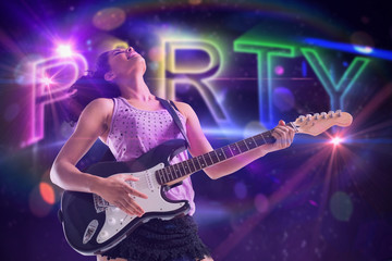 Pretty girl playing guitar against digitally generated colourful party text