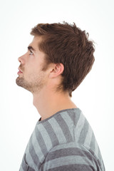 Side view of serious man looking up