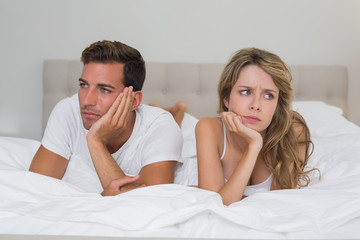 Couple not talking after an argument in bed