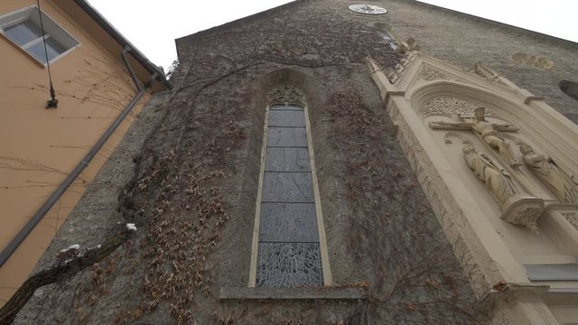 Window and a statue of Saint Blaise Church