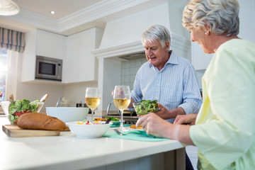 Senior couple having meal together