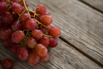 Close-up of red bunch of grapes with water droplets