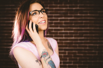 Smiling woman talking on mobile phone