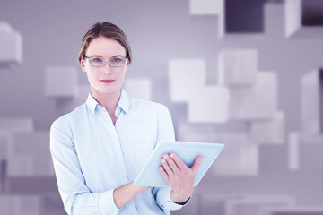 Businesswoman using tablet pc  against abstract white room