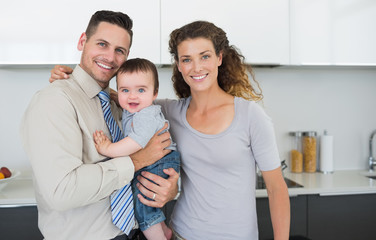 Smiling parents with cute baby boy