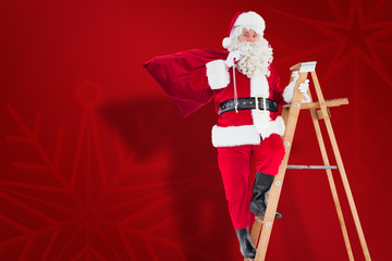 Santa claus climbing a ladder against red snowflake background