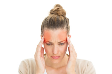 Woman with headache touching her temples on white background