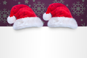 Santa hat on poster against snowflake wallpaper pattern