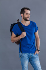 Man in blue t-shirt with backpack 