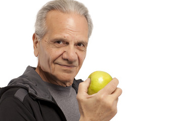 Senior man with an apple