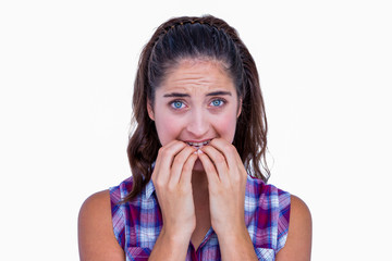 Nervous pretty brunette looking at camera 