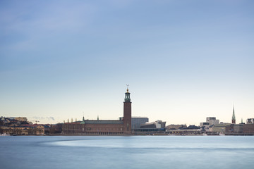 Beautiful scenic panorama of the Old City (Gamla Stan) cityscape pier architecture with historic town houses with colored facade in Stockholm, Sweden. Creative long time exposure landscape photography