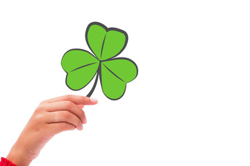 Shamrock against hand raised up