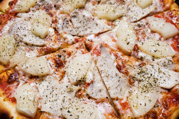 pizza background. traditional italian cuisine. chicken pineapple topping