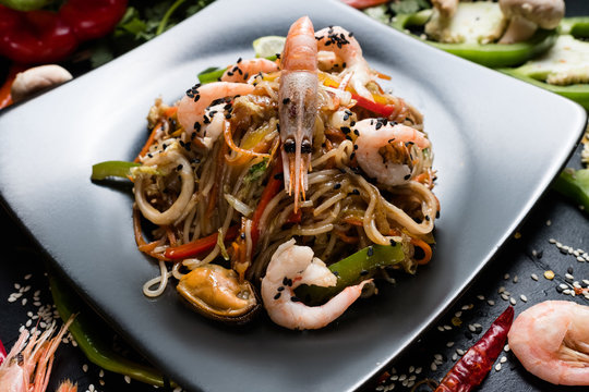 asian cuisine. healthy nutrition. wholesome food diet. noodle prawn shrimp seafood and vegetable dish