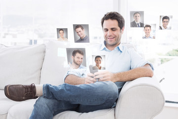 Cheerful man sitting on the couch using his smartphone against profile pictures