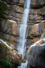 Waterfall in the mountain Austrian village of Hallstatt. Austria