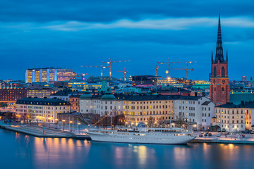 Fototapeta premium Sunset view onto Stockholm old town Gamla Stan and Riddarholmen church in Sweden