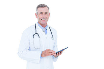 Image of doctor standing with tablet pc