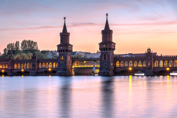 Fototapeta na wymiar The lovely Oberbaumbruecke across the river Spree in Berlin at sunset