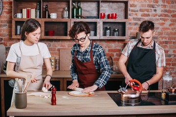 Cooking class. People preparing meals together