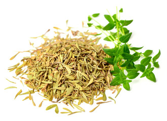 dried thyme leaves with fresh thyme isolated on white