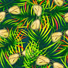 green palm leaves and sunglasses. pattern texture