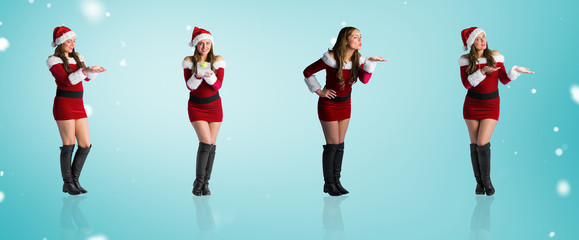 Composite image of different festive blondes against blue vignette