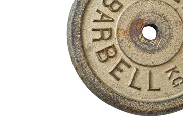 Detail of barbell weight on white background.