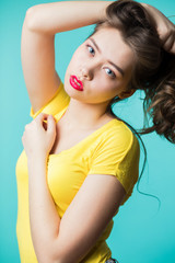 Close up portrait of a young beautiful brunette woman looking at camera.