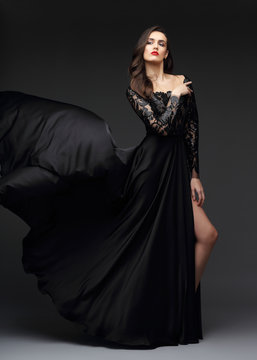 Young elegant woman in long black dress.