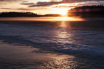Mist over lake in sunset