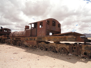 Fototapeta na wymiar Rusting locomotives in the train cemetery, Uyuni, Bolivia