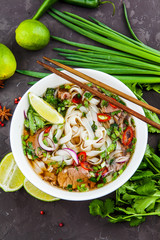 Vietnamese Beef Noodle Soup Pho Bo with beef on dark background - 202723433